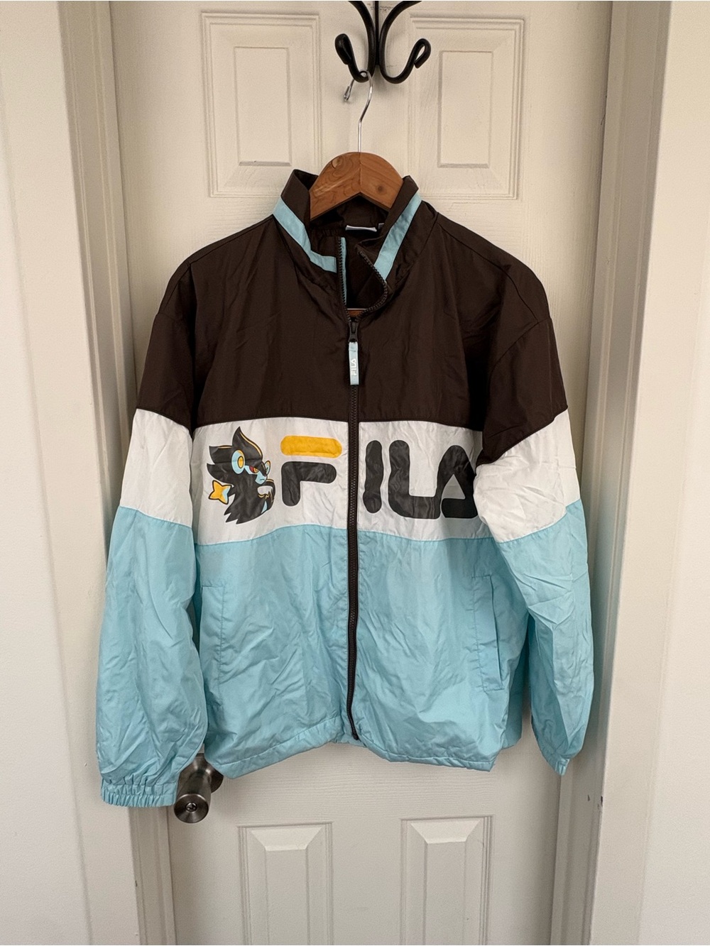 FILA Men’s Pokemon Luxray Colorblock Windbreaker Jacket in Brown/Light Blue/Whit